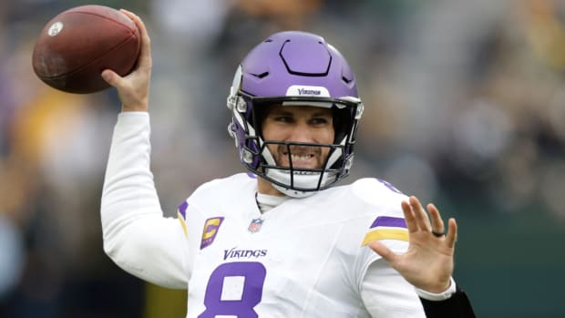Vikings quarterback Kirk Cousins warms up before a game.
